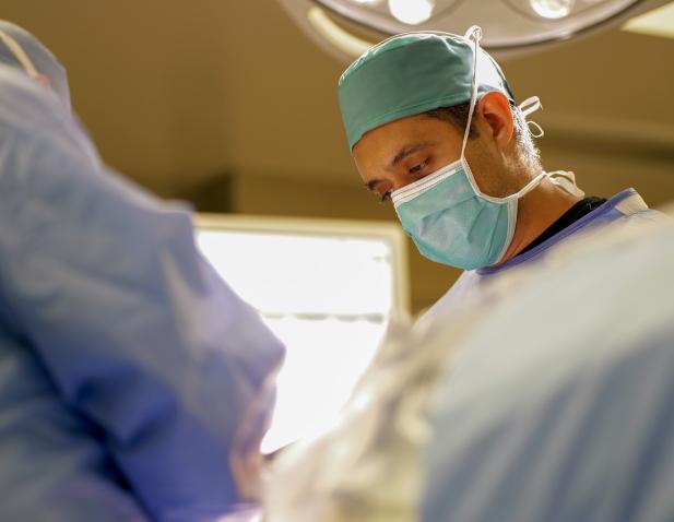 Dr. Fayed performing surgery.