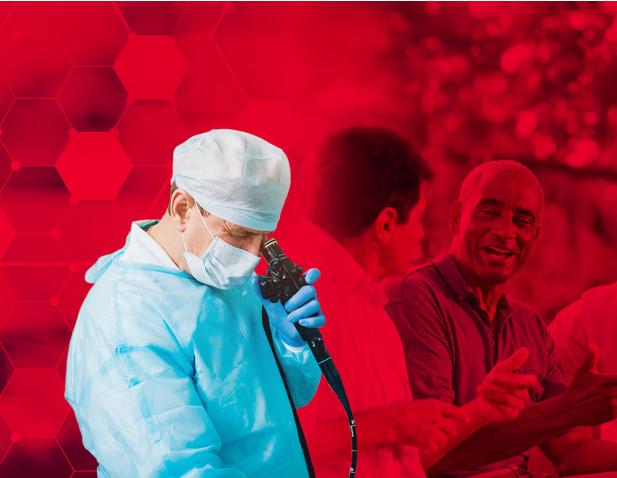 A photo showing a doctor with a colonoscope.