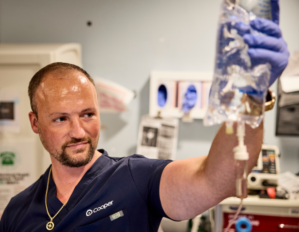 Nurse holding IV bag