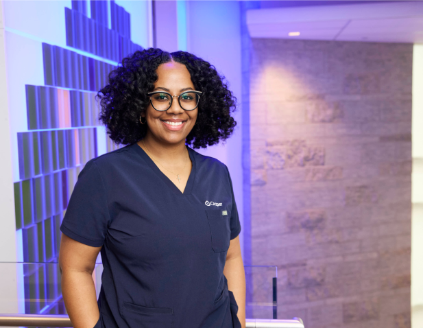 Nurse standing in front of illuminated wall
