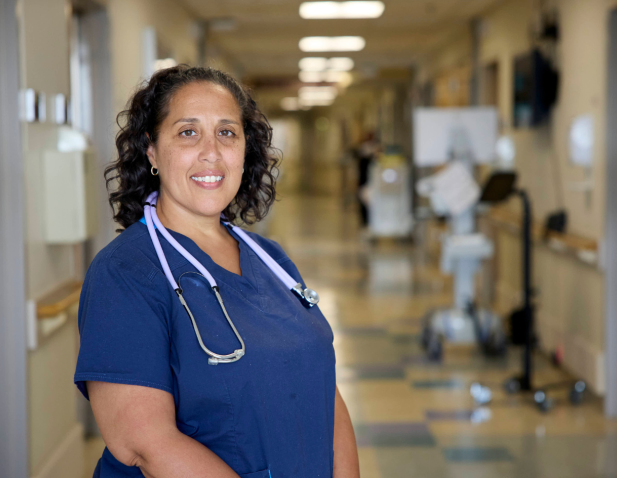 Nurse in hallway with stethoscope
