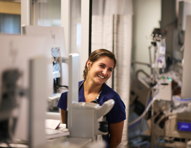 Nurse sitting in front of computer monitor