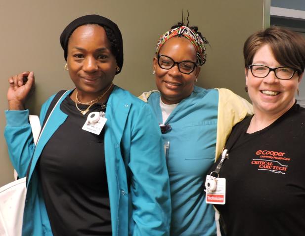 group of three technicians in hall 
