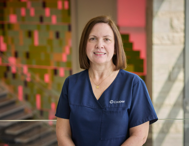 Nurse in front of illuminated wall