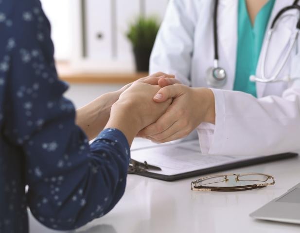 Doctor holding hands