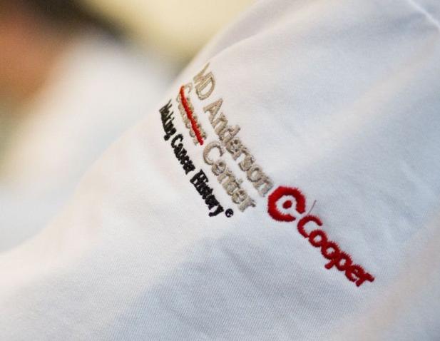 MD Anderson Cancer Center at Cooper logo on white coat of physician 