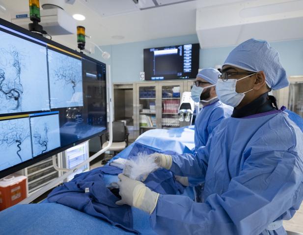 Neurointerventional surgeons in the OR