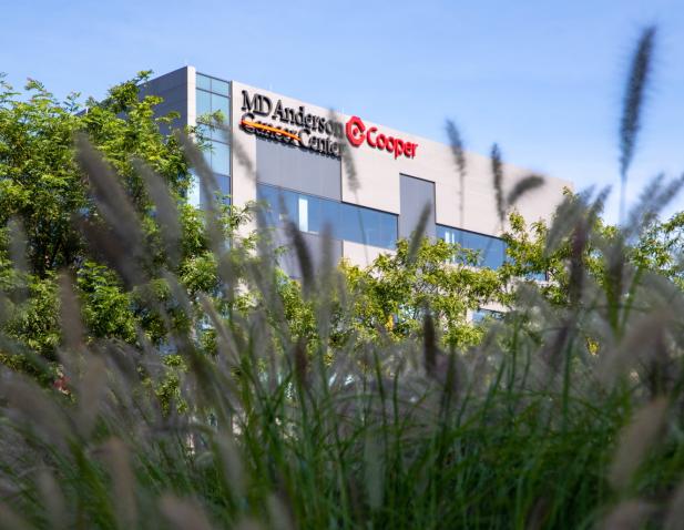 MDA Cancer Center exterior through grass