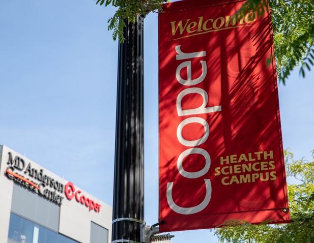 Cooper banner MDA Cancer Center blue sky trees