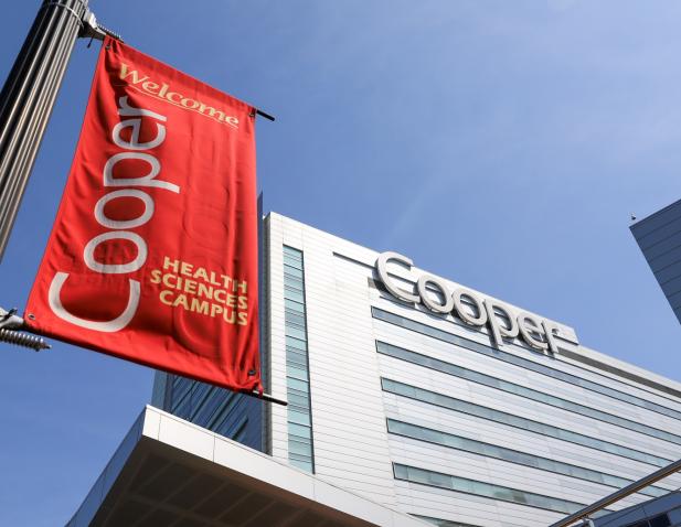 Cooper banner and sign on Roberts Pavilion from ground