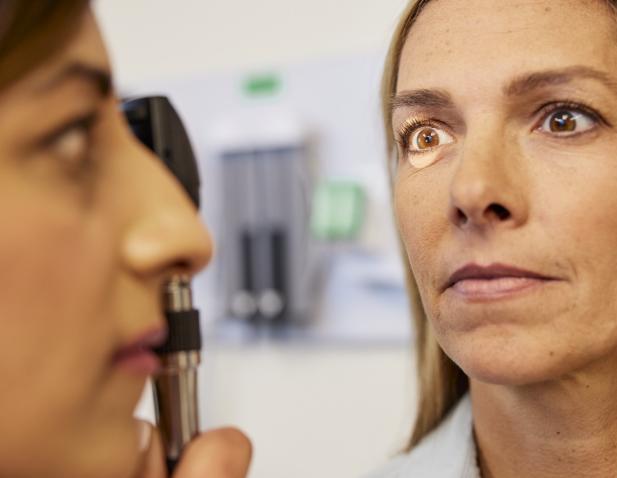 eye exam female doctor and patient