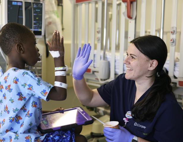 nurse high five child patient