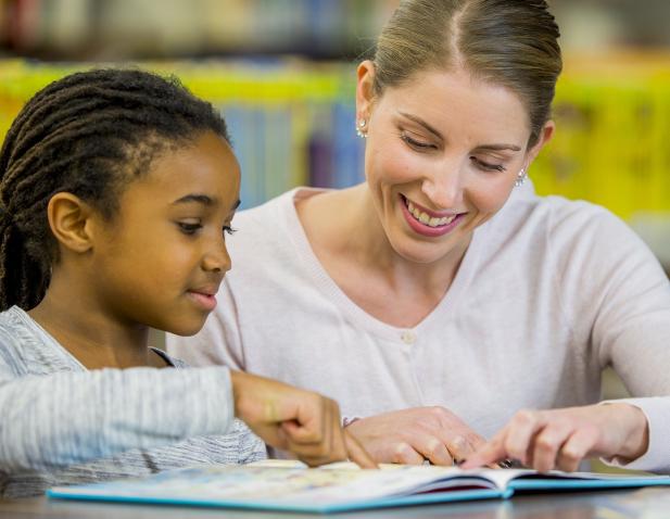 2025_Learning_Center_iStock-638560918-Student Teacher Reading_1538x956.jpg
