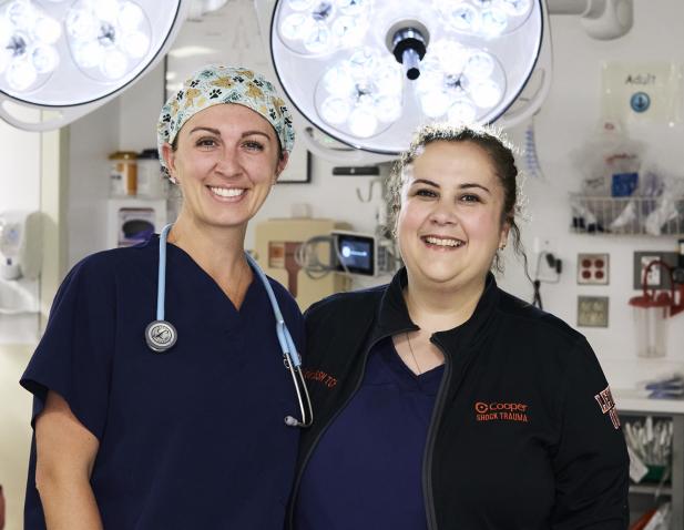 two trauma nurses lights smiles