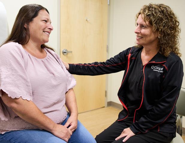 female doctor and patient exam room