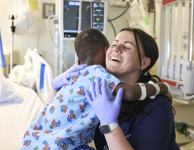 nurse hugging child patient