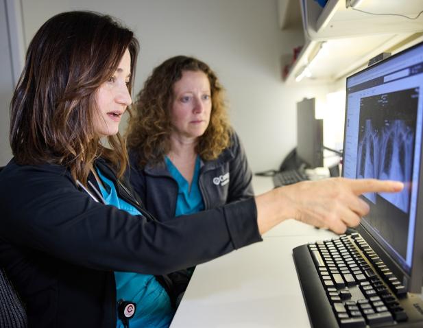 technicians at monitor x-ray