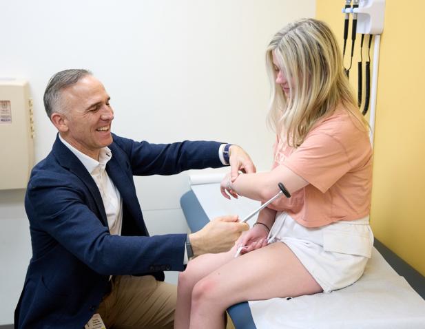 female teenage patient doctor Drake exam room