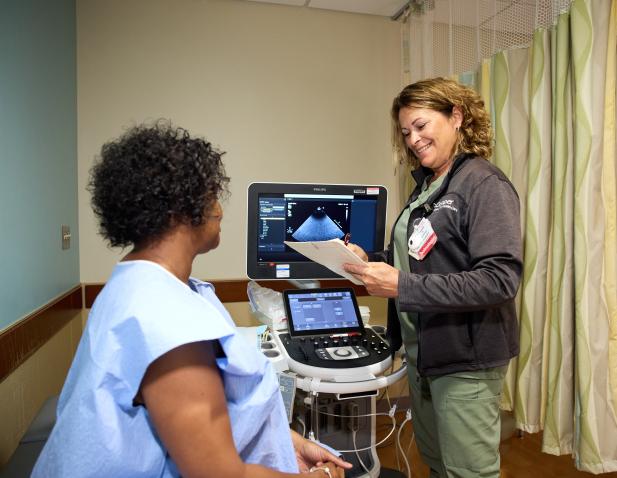 Tech and patient heart test. 