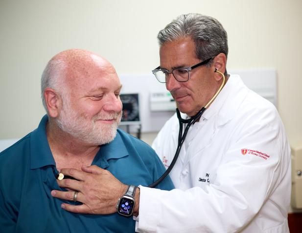 dr koren listeing to patients heart