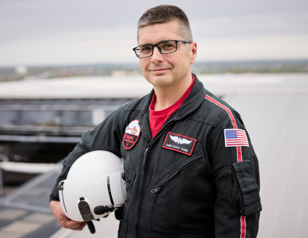 Flight nurse holding helmet