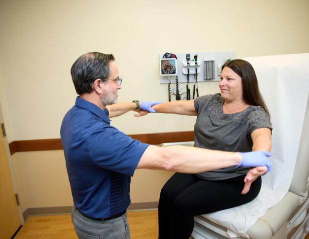 Sports medicine expert with patient