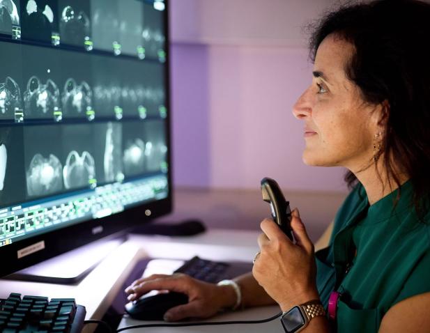 Robyn Roth MD examining a mammogram