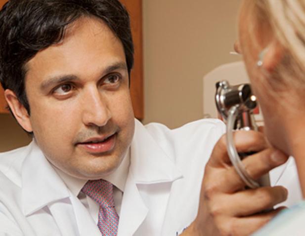 Dr. Nadir Ahmad examining a patient
