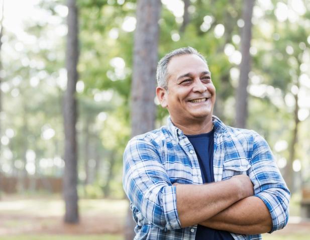Middle aged man wearing a plaid shirt