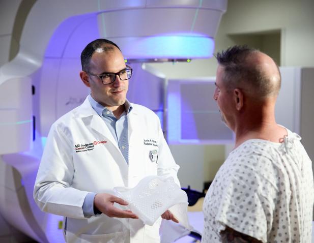 Dr. Mann talking to patient about SRS for the brain.