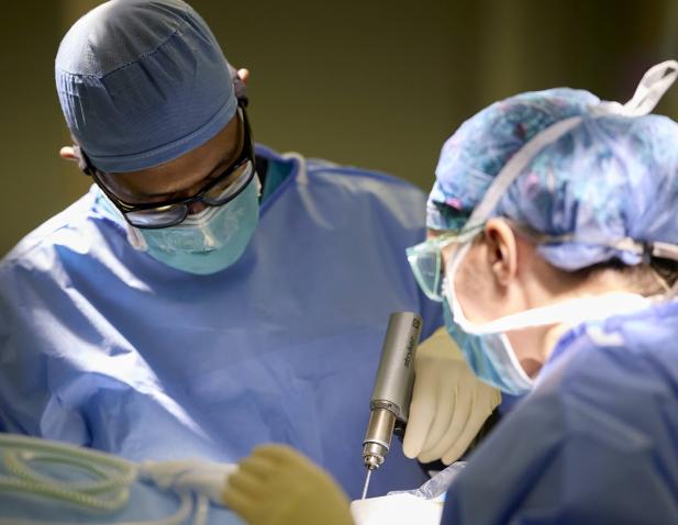 Cooper surgeons operating on patient