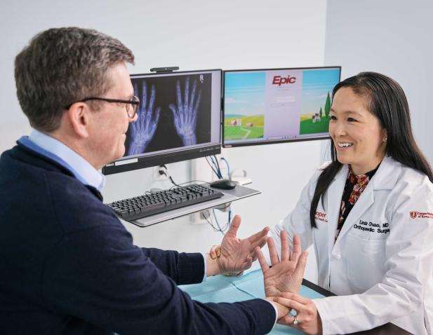 ortho hand physician with patient