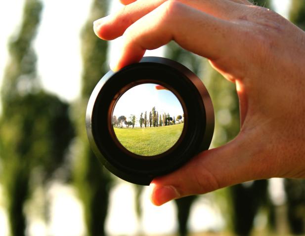 Looking through a lens to see a landscape.