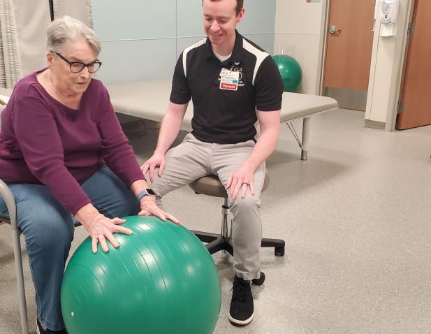 physical therapist providing rehabilitation instruction