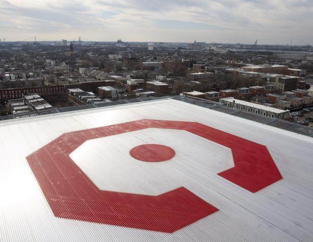 Sweeping view of Camden city from Cooper helipad. Corner of the helipad has a large red Cooper C logo.