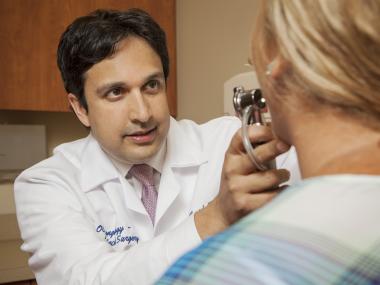 Dr. Ahmad examining patient