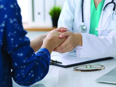 Doctor holding hands