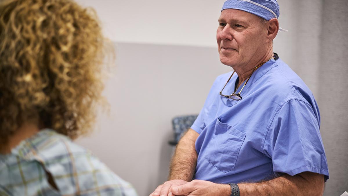 Physician speaking with female patient