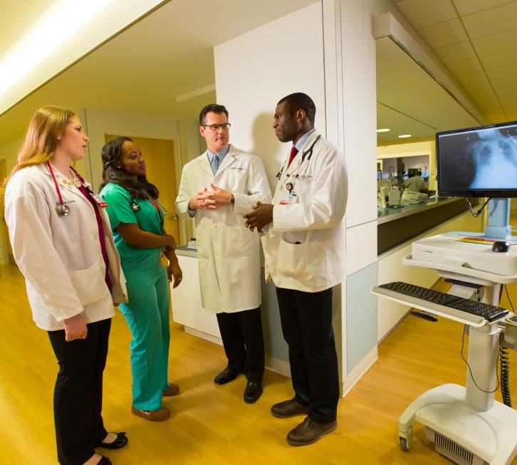 doctor and three medical students on a hospital unit